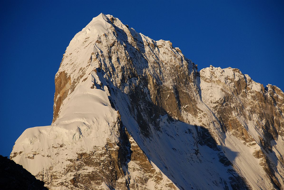 25 Sunrise On Nyanang Ri Close Up From Kong Tso Nyanang Ri (7071m) South and East Faces close up at sunrise from Kong Tso camp.